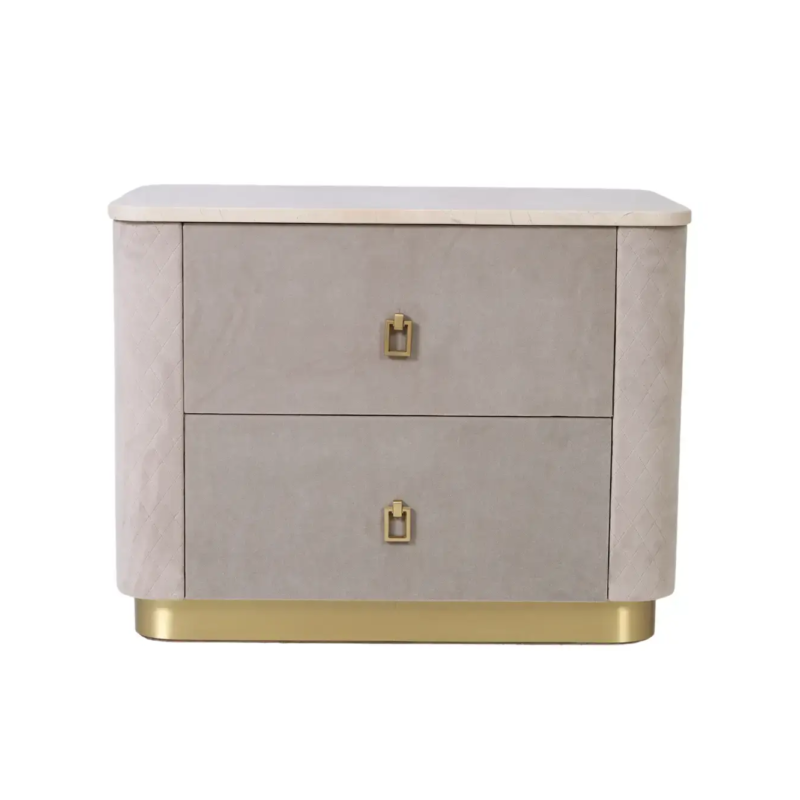Charm bedside pedestal front view with two taupe velvet drawers, quilted rounded sides, cream stone-look top, brushed gold drop handles and gold plinth